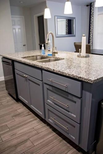 a kitchen with a sink and a granite counter top at Home Away From Home (w/ Pool) in San Antonio