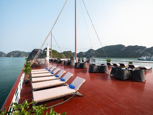 a deck of a boat with lounge chairs on it at Aqua Of The Seas Cruise Halong in Ha Long