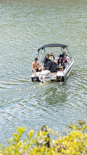 a group of people on a boat in the water at Volare Guatapé isla de descanso y retiro in Guatapé