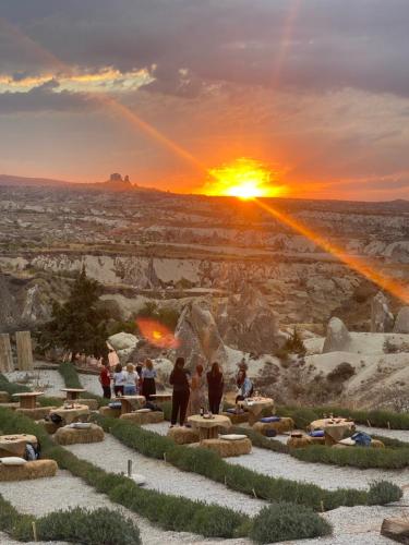 a group of people watching the sunset at the grand canyon at Wish Cappadocia in Uchisar