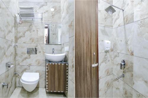 a bathroom with a toilet and a sink at FabHotel Yellow Leaf in Ludhiana