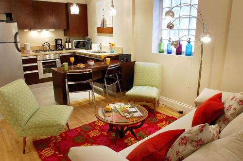 a kitchen and living room with a couch and a table at Poetry Building Recoleta in Buenos Aires