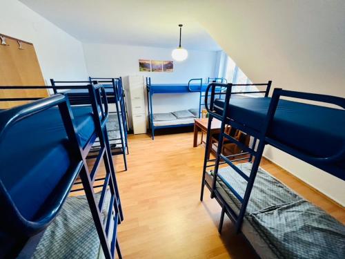 a group of bunk beds in a room at Hostel Pod Gromadzyniem in Ustrzyki Dolne