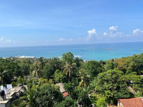 a view of the ocean from a resort at Kapaliya Unawatuna in Unawatuna