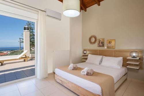 A bed or beds in a room at Charilena's luxury apartment