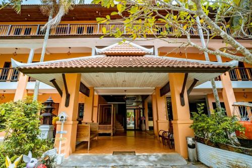 an entrance to a building with a pavilion at Kasalong Resort and Spa Pattaya in Pattaya Central