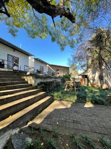a set of stairs in front of a building at Farquhar Lodge in Ladysmith