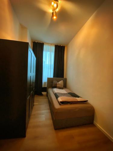 Postel nebo postele na pokoji v ubytování Flat Hundertwasser