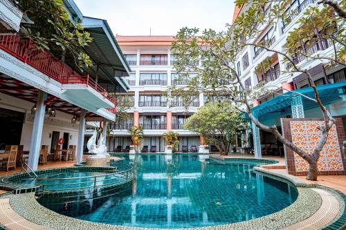 a swimming pool in the middle of a building at Kasalong Resort and Spa Pattaya in Pattaya Central