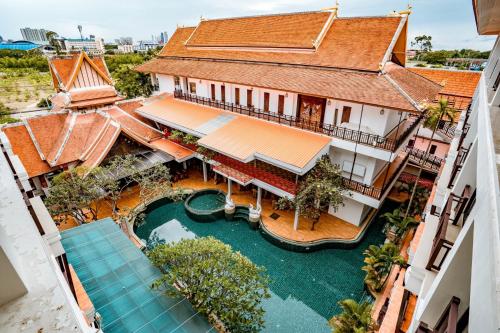 an aerial view of a building with a swimming pool at Kasalong Resort and Spa Pattaya in Pattaya Central
