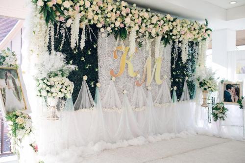 a wedding altar with flowers and a sign that reads lil at Kasalong Resort and Spa Pattaya in Pattaya Central