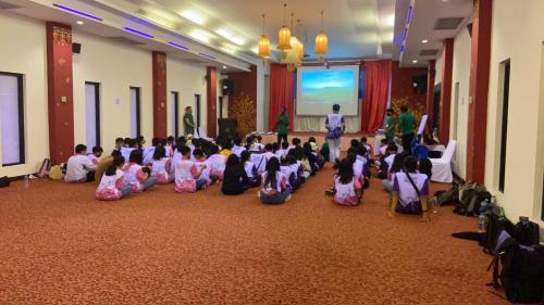 a group of children sitting on the floor in a room at Kasalong Resort and Spa Pattaya in Pattaya Central