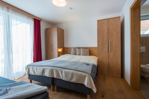 Ένα ή περισσότερα κρεβάτια σε δωμάτιο στο Apartment Dorf Wagrain Alpenleben by AlpenTravel