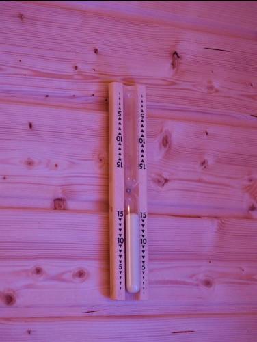 two thermometers sitting on top of a wooden table at Luxus Spa auf tollem Anwesen in Neubulach