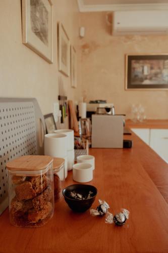 a table with a jar of food and a bowl on it at The Bean Tree in McGregor