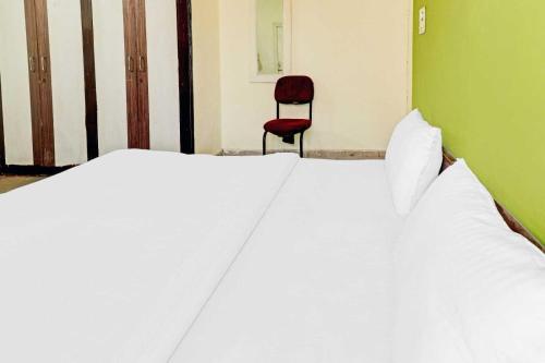 Кровать или кровати в номере SPOT ON Ganesh Guest House