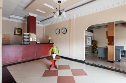 a lobby of a hospital with a waiting room at Urbanview Hotel Syariah Residence Medan by RedDoorz in Medan