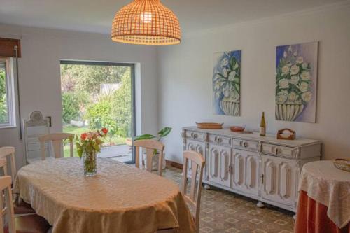 a dining room with a table and a buffet at Delfim e Carmo - Entire House com Piscina in São Pedro do Sul