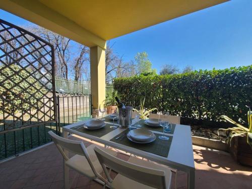 a table and chairs sitting on a patio at Sandra Apartment in Lonato del Garda