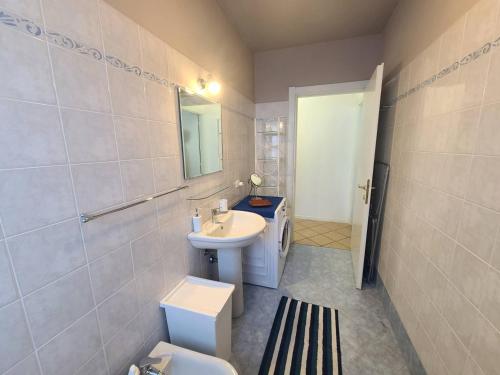 a bathroom with a sink and a toilet at Sandra Apartment in Lonato del Garda