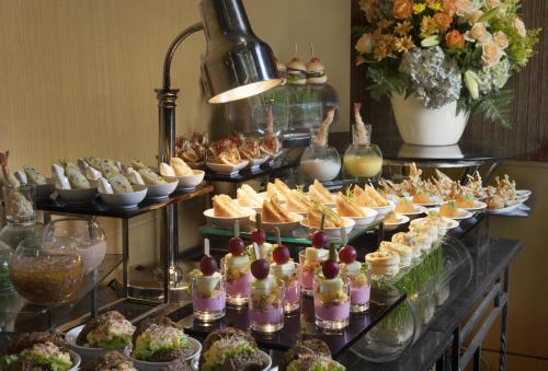 a buffet with many different types of food on display at Hotel Ciputra Jakarta managed by Swiss-Belhotel International in Jakarta