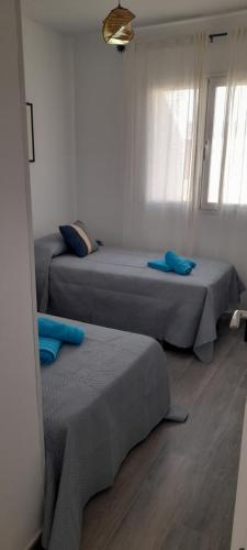 Postel nebo postele na pokoji v ubytování Alojamiento Anémona