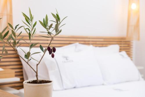 Кровать или кровати в номере Olivea Premium Holiday Homes