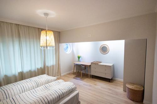 a living room with a couch and a desk at Grand Relax Cape Cod by RV Apartments in Varna City