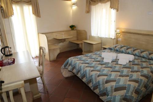 Ένα ή περισσότερα κρεβάτια σε δωμάτιο στο B&B Residenza Cardinale