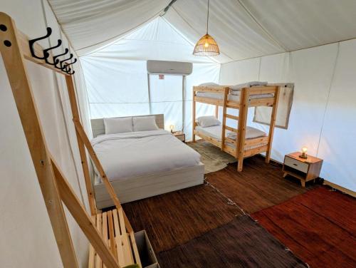 a bedroom with a bed in a tent at Park Timna in Eilat