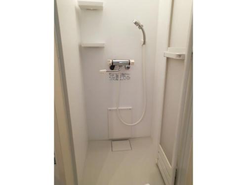a small bathroom with a shower in a stall at Tokyo stay Hut SARI - Vacation STAY 27239v in Tokyo