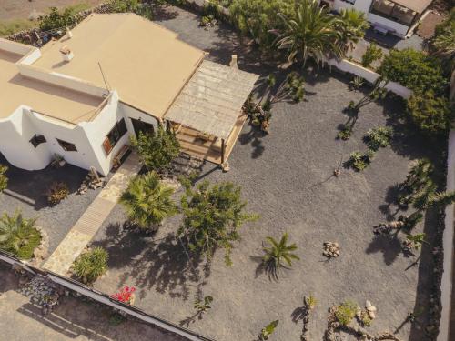 an overhead view of a house with palm trees at Casa Maja in Lajares