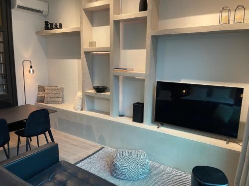 a living room with a large flat screen tv on a wall at 3 Bedroom Art-Nouveau Apartment with Free Parking in Ghent