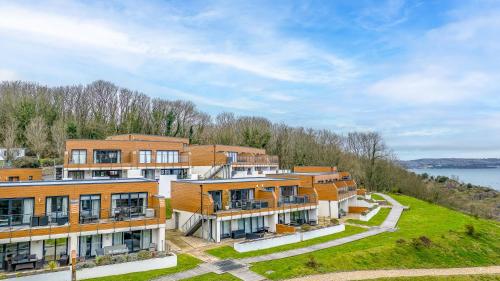 an aerial view of a row of apartment buildings at Plover 1, The Cove - On site pool - Wi-Fi in Brixham