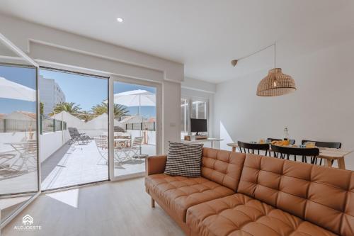 a living room with a couch and a view of the ocean at The Terrace - Santa Cruz in Santa Cruz