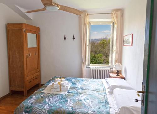 a bedroom with a bed and a window at NEW! La Stanza in Villa in Lucca