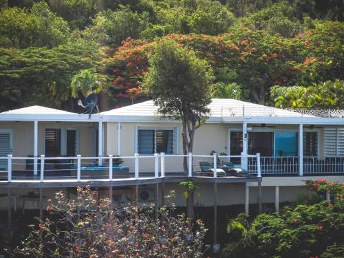 a white house with a bird sitting on top of it at CARIBBEAN SPLENDOR WITH MILLION DOLLAR VIEWS in Christiansted