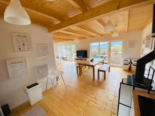 a large living room with a table and chairs at Chata Cérov in Púchov