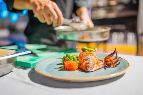 a plate of food with a lobster on a table at Moon Hotel & SPA. in Aguadulce