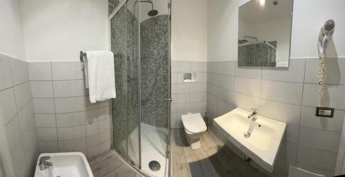 a bathroom with a shower and a sink and a toilet at Boutique Rooms in Rome