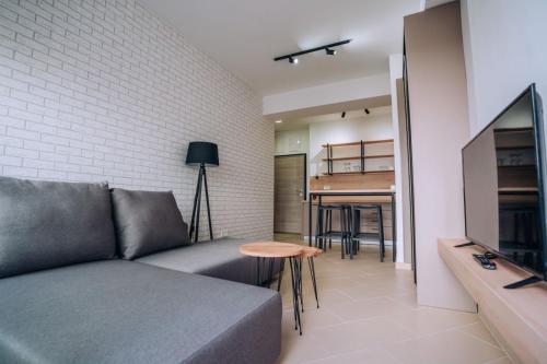 a living room with a couch and a table at Leon Luxury Apartments in Ohrid