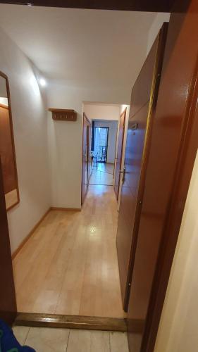 an empty hallway with a hallway leading to a room at Princess and Prince Apartman in Budapest