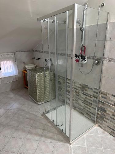 a shower with a glass door in a bathroom at Il Bacio del Mare in Agropoli