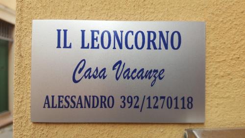 a sign on a wall with the name of a building at Romiti Apartment in Ferrara