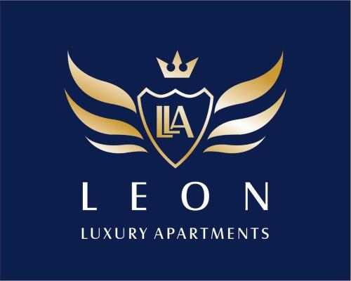a logo for a luxury apartments with wings and a crown at Leon Luxury Apartments in Ohrid