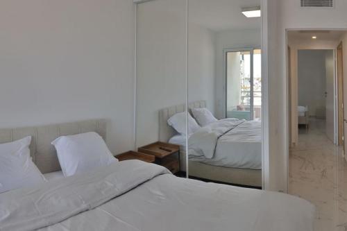 A bed or beds in a room at Port Azur