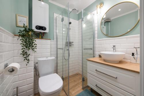 Koupelna v ubytování Radunia Apartment z parkingiem przy dworcu
