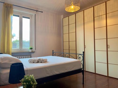 a bedroom with a bed with towels on it at Appartme Morazzone 7 in Milan