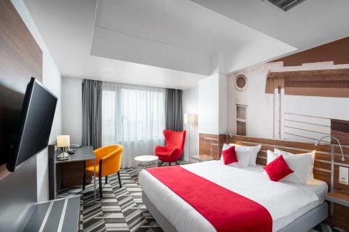 Postel nebo postele na pokoji v ubytování Mercure Bucharest Unirii
