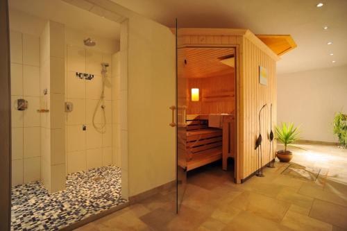 a bathroom with a shower and a sink at Appartement Erika in Hopfgarten im Brixental